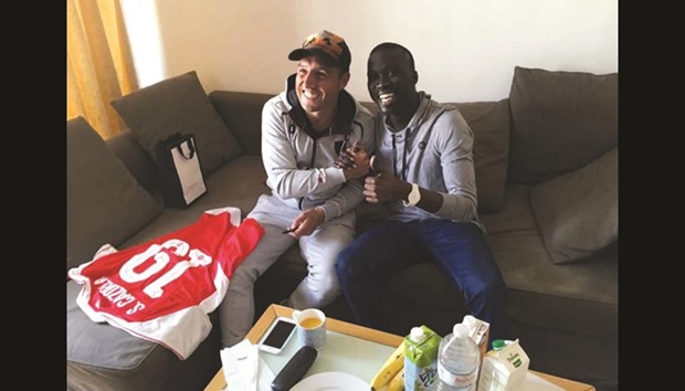 Arsenal midfielder Santi Cazorla had visited the late Serigne Abdou (R) in London where he was being treated