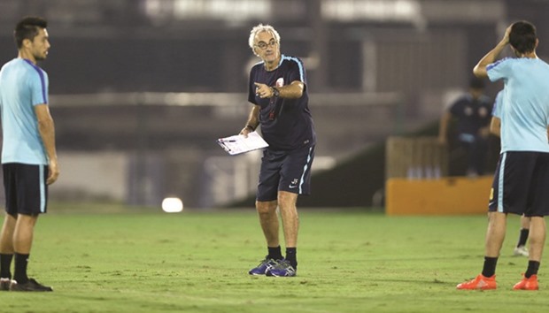 Qatar national team coach Jorge Fossati instructs the players during a training session which was held yesterday.