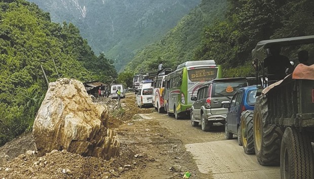 Heavy vehicles line up in a traffic jam on a landslide-hit road of Prithvi Highway in Chitwan. The road often encounters landslides during monsoon season, causing road blockade for long time. Vehicles even face accidents in such highways in Nepal.