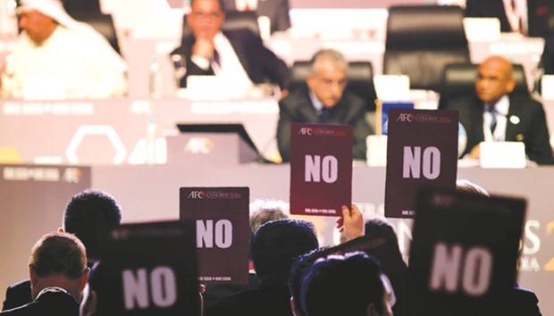 Members of the Asian Football Confederation (AFC) hold up u2018NOu2019 voting cards during the AFC Extraordinary Congress in Goa yesterday. Members voted 42 to one against supporting the agenda at the meeting.