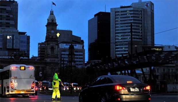 Police direct traffic in the central business district of Adelaide after severe storms and lightning strikes knocked out power to South Australia on Wednesday.
