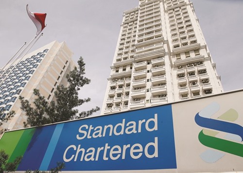A Standard Chartered signboard is seen outside of a building in Jakarta. The London-based bank, which controls the MAXpower Group, acknowledged on Tuesday it was being investigated by the US Department of Justice over claims an Indonesian power company had paid kickbacks to secure contracts.