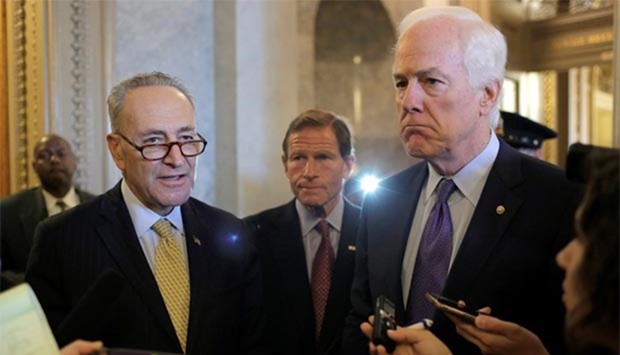 Senators Chuck Schumer (left), Richard Blumenthal (centre) and John Cornyn speak after the Senate voted to override President Barack Obama's veto of a bill that would allow lawsuits against Saudi Arabia's government over the September 11 attacks, in Washington on Wednesday.