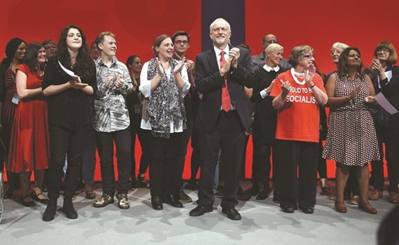 Jeremy Corbyn acknowledges the delegates as he receives a round of applause after speaking on the fourth day of the annual Labour Party conference in Liverpool yesterday.