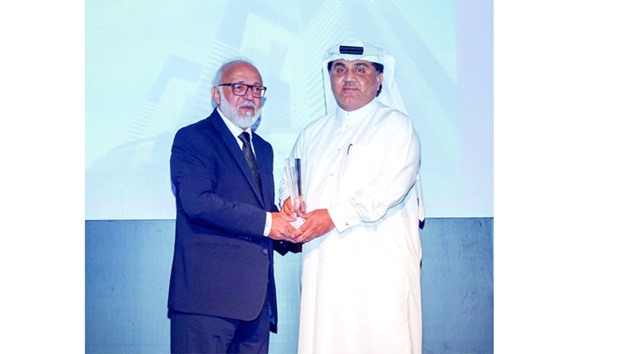 Al-Obaidli receives the award during a recent ceremony held in Doha.
