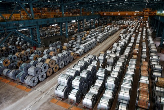 Rolls of steel are stacked inside the China Steel Corporation factory. Chinese steel exports are near all-time highs, while regulators in the US, Europe and India impose punitive tariffs to protect their domestic markets.