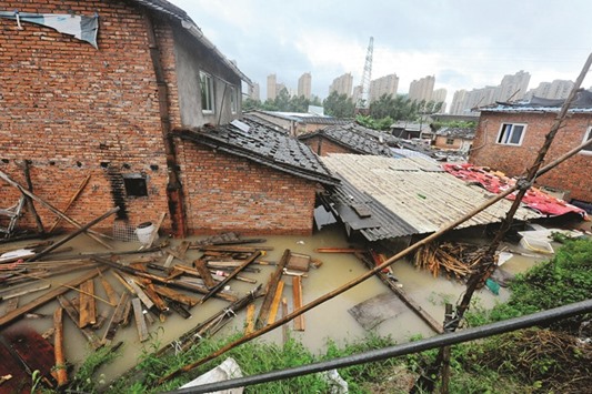 Houses are submerged in floodwaters brought by typhoon Megi in Ningde, eastern Chinau2019s Fujian province yesterday.