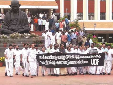 UDF legislators walk out of the Kerala Assembly protesting against the fee hike.