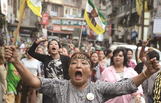 Supporters of the Gorkha Peopleu2019s Liberation Front (GJMM) take part in a rally during a strike at Kalimpong town, some 75km, from Siliguri, yesterday.