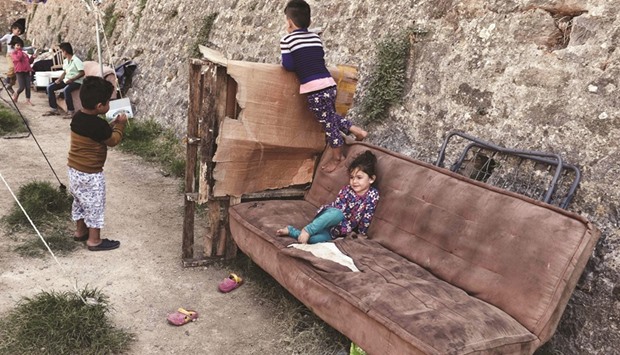 Children play in a municipality-run camp housing migrants and refugees on the Greek Aegean island of Chios.