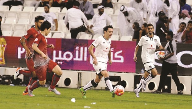 Xavi (centre), who now plays for Qatari club Al Sadd, will this week visit a Generation Amazing pitch in Jordan and conduct training sessions with the youngsters in a refugee camp.