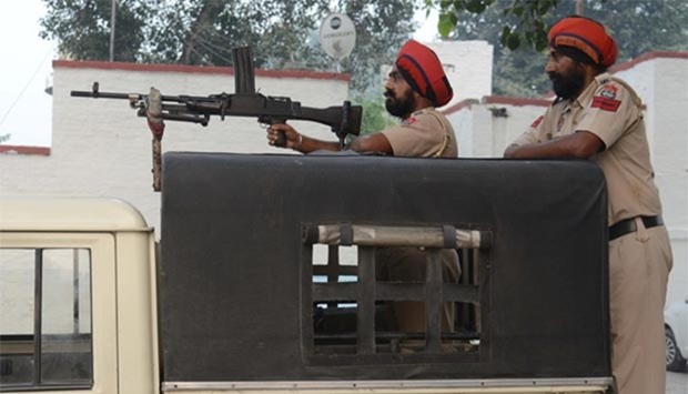 Police in India's Punjab state stand guard at Attari Railway Station, about 35 kms from Amritsar, on Thursday.