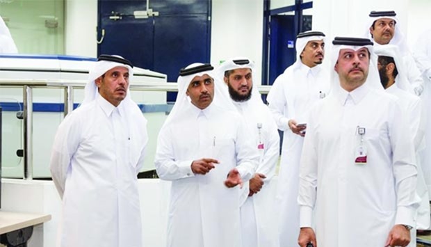 HE the Prime Minister and Minister of Interior Sheikh Abdullah bin Nasser bin Khalifa al-Thani with Kahramaa officials during his visit to the Thumama facility.