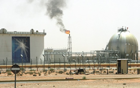 A gas flame is seen in the desert near the Khurais oilfield, Saudi Arabia (file). The kingdom has the highest budget deficit among the worldu2019s 20 biggest economies and may delay its first international bond issue.
