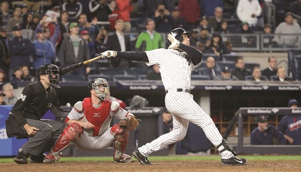 New York Yankees first baseman Mark Teixeira hits a walk off grand slam against the Boston Red Sox during the ninth inning at Yankee Stadium.