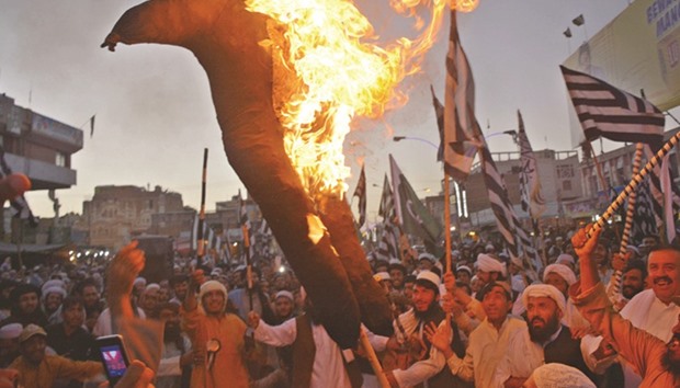 Supporters of the Jamiat Ulema-i-Islam-Nazaryati (JUI-N) party burn an effigy of Indian Prime Minister Narendra Modi during a demonstration in Quetta yesterday. Prime Minister Nawaz Sharif condemned the u201cnaked aggression of Indian forcesu201d yesterday after two Pakistani soldiers were killed in firing along the Line of Control.