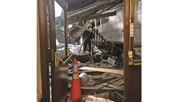 The wreckage is seen after the train crashed at the Hoboken station.