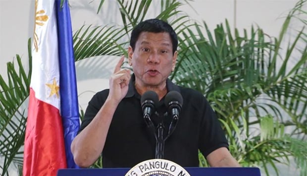 Philippines President Rodrigo Duterte speaks at the Davao international airport terminal building on Friday, after arriving from an official visit to Vietnam. Duterte drew a parallel with his deadly crime war and Hitler's massacre of Jews.