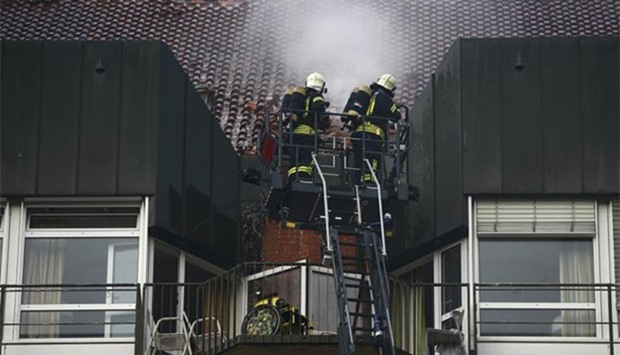 Firefighters exinguish a fire which broke out in the Bergmannsheil hospital in Bochum, Germany on Friday.