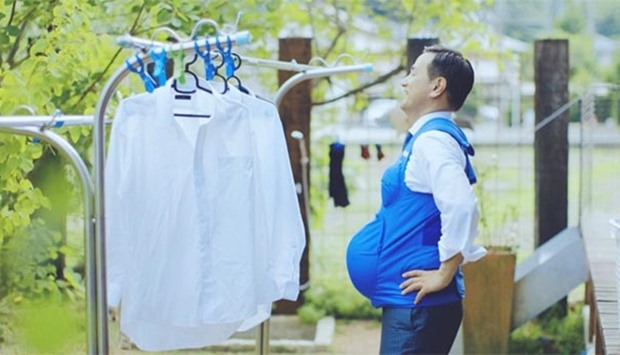 Tsugumasa Muraoka, Yamaguchi prefecture governor, wears a pregnancy vest in this handout screen grab from a video launched this week.