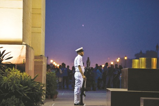 Indian Navy personnel stands guard at the Tomb Of The Unknown Soldier at India Gate in New Delhi yesterday.