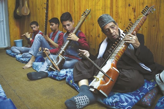 Music students play the Dilroba u2013 an Afghan string instrument u2013 during a class at the Afghanistan National Institute of Music in Kabul.