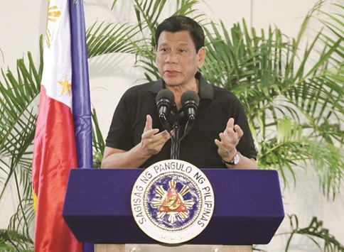 President Rodrigo Duterte delivers a speech at the Davao international airport terminal building early yesterday, shortly after arriving from an official visit to Vietnam.