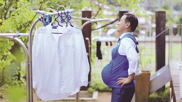 Muraoka is seen with a vest simulating a womanu2019s breasts and belly at seven months of pregnancy, in a video called The Governor is a Pregnant Woman, in this handout screen grab from the video which was launched to the public on Tuesday.