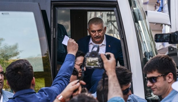 Turkish Prime Minister Binali Yildirim (C) arrives for a rally on September 4, 2016 in Diyarbakir. Turkish warplanes have destroyed 10 Kurdish rebel positions in the restive southeast as Ankara steps up its fight against the outlawed Kurdistan Workers' Party (PKK), state media reported on Sunday.  AFP