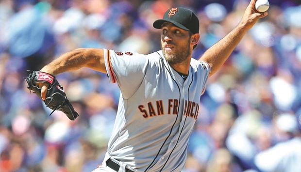 San Francisco Giants starting pitcher Madison Bumgarner delivers a pitch during the first inning against the Chicago Cubs at Wrigley Field in Chicago on Saturday. (USA TODAY Sports)
