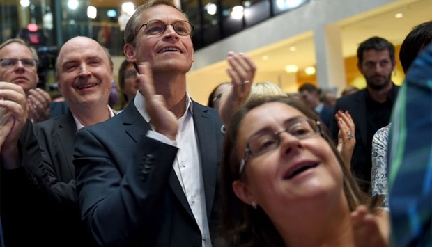 Berlin's Mayor Michael Mueller of the Social Democrats (SPD) reacts as exit polls were announced on TV during an election results party on September 4, 2016 in Berlin. Germany's anti-migrant populists AfD recorded strong results, around 21 percent at state elections, unseating Chancellor Angela Merkel's party from second place, exit polls showed.