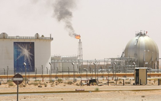 A gas flame is seen in the desert near the Khurais oilfield, Saudi Arabia (file). Saudi Arabia is by far the largest Opec producer, pumping more than twice as much as the second-biggest, Iraq. Even so, plunging oil prices since mid-2014 have put stress on Saudi Arabiau2019s finances, causing a big budget deficit last year and forcing the kingdom to seek new sources of income, including taxes and other fees and to cut spending.