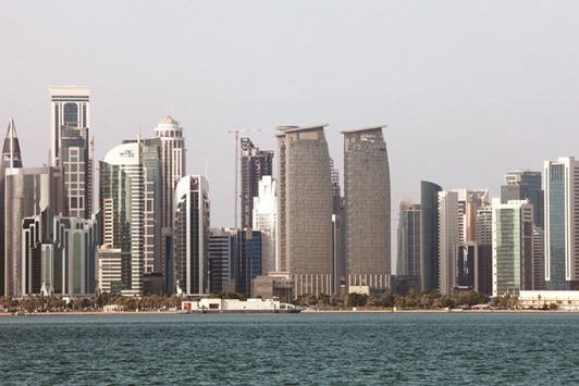 City skyscrapers stand on the skyline in Doha. S&P expects Qataru2019s economy to grow by about 4% during 2016-2019, in line with the pace of growth over the last four years.