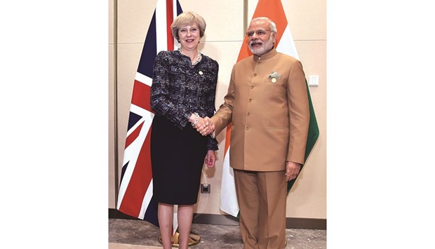 Prime Minister Narendra Modi shakes hands with his British counterpart Theresa May ahead of a meeting on the sidelines of G20 Summit in Hangzhou yesterday.