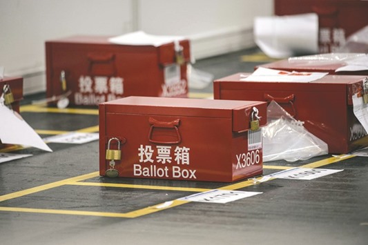 Ballot boxes for the Legislative Council election are seen at the central counting station in Hong Kong early yesterday.