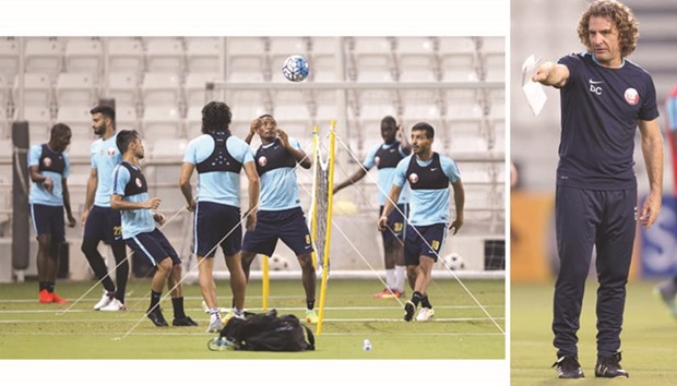 Qatar players during a training session ahead of their 2018 World Cup third round qualifying campaign.  (Right) Qatar coach Jose Daniel Carreno.