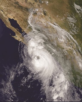 This NASA-NOAA GOES West satellite photo taken 1145 UTC September 6, 2016 shows Hurricane Newton over the western coast of Mexico. Hurricane Newton made landfall early Tuesday near the Los Cabos resort area on Mexicou2019s west coast, packing 90-mile (145-kilometer) winds, the US National Hurricane Center said.u201dHurricane winds are spreading over southern Baja California,u201d the center said in a bulletin that placed the storm five miles (eight kilometers) southeast of Cabo San Lucas, a popular tourist destination.