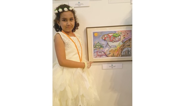 ACCOLADES: Sanjeena poses with her award-winning drawing that was adjudged as one of this yearu2019s World Contest award winners at the 10th Toyota Dream Car Art Contest.