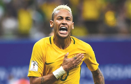 Brazilu2019s Neymar Jr celebrates after scoring against Colombia during their Russia 2018 FIFA World Cup football qualifier match, in Manaus, Brazil.