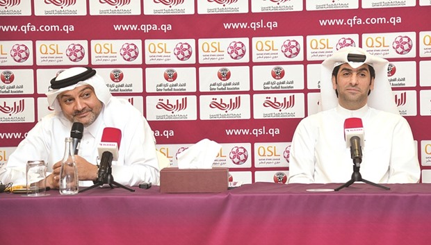 QSL CEO Hani Ballan (L) with Qatar Players Association Chairman Salman al-Ansari.