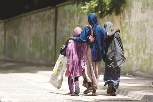 Girls walking on a street in Maiduguri, Borno, Nigeria.