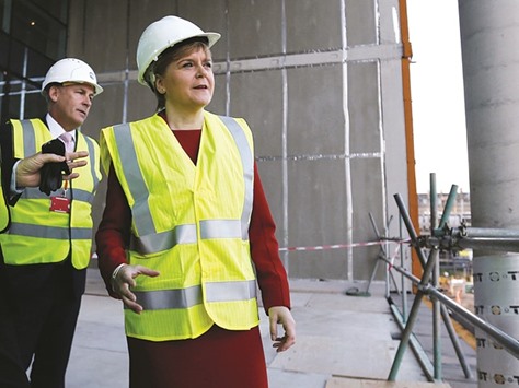 Scotlandu2019s First Minister Nicola Sturgeon views the construction work underway during a visit to the new Borroughmuir High School in Edinburgh, Scotland.