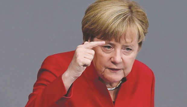 Chancellor Angela Merkel addresses the Bundestag in Berlin yesterday.