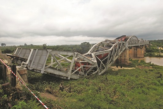 The partially collapsed railroad bridge connecting Burkina Faso to Ivory Coast is seen in Dimbokro, Ivory Coast.