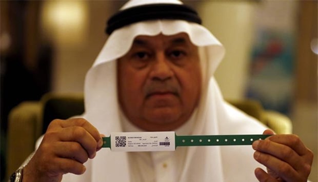 A Saudi official displays an electronic identification bracelet that authorities are giving to pilgrims ahead of the annual Haj pilgrimage in the holy city of Makkah.