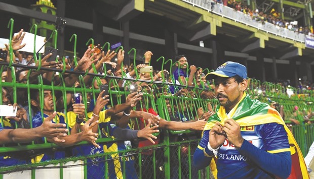 Sri Lankau2019s Tillakaratne Dilshan acknowledges the crowd at the end of the last match of his career at the R. Premadasa Cricket Stadium in Colombo yesterday.