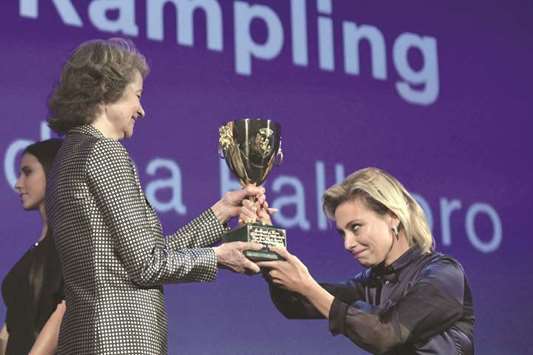 Rampling receives the Coppa Volpi for Best Actress from jury member Italian actress Jasmine Trinca.