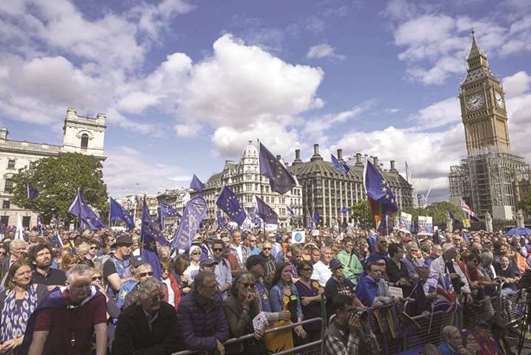 Pro-EU demonstrators rally during the Peopleu2019s March for Europe against Brexit in Londonu2019s parliament square. Thousands joined the march calling on politicians to u2018unite, rethink and reject Brexitu2019.