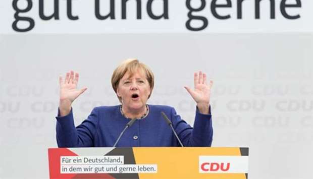 Chancellor Angela Merkel speaks during an electoral meeting in Delbrueck, western Germany, on Sunday.
