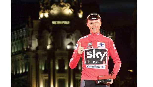 Team Sky cyclist Chris Froome celebrates on the podium after winning the Vuelta a Espana in Madrid yesterday. (AFP)